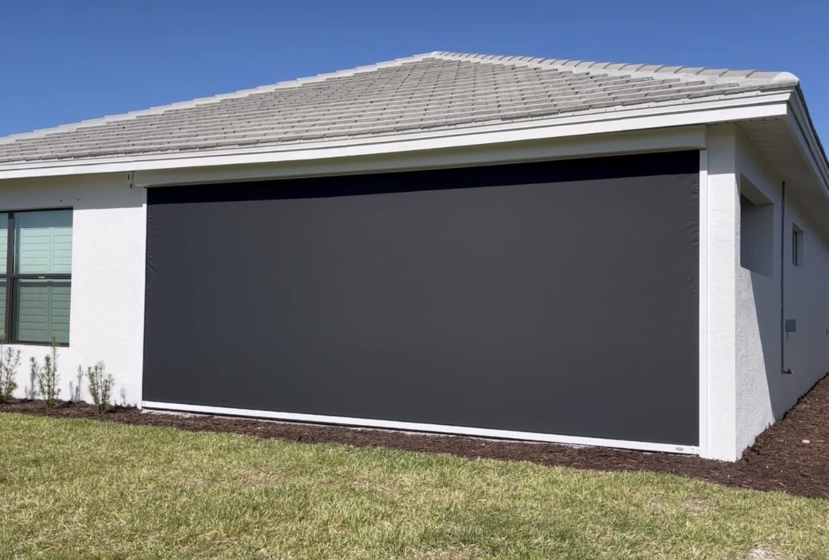 Exterior motorized hurricane screen on an Osprey, Florida patio