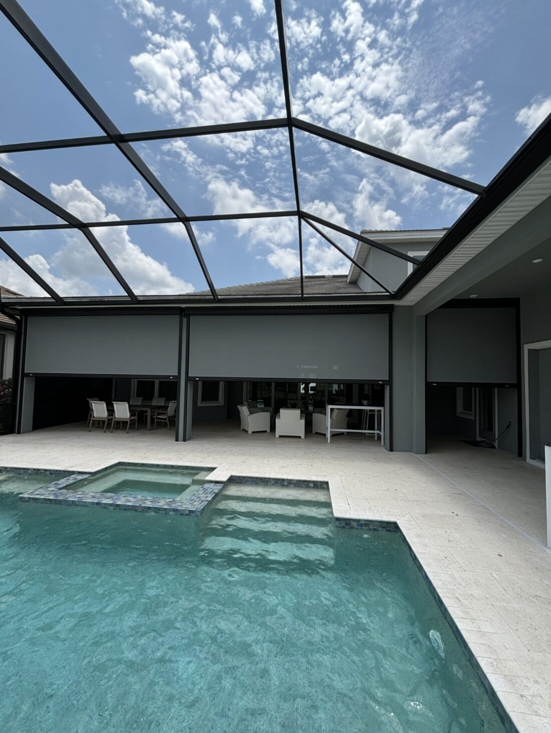 MagnaTrack motorized hurricane screens installed on a Siesta Key pool cage lanai