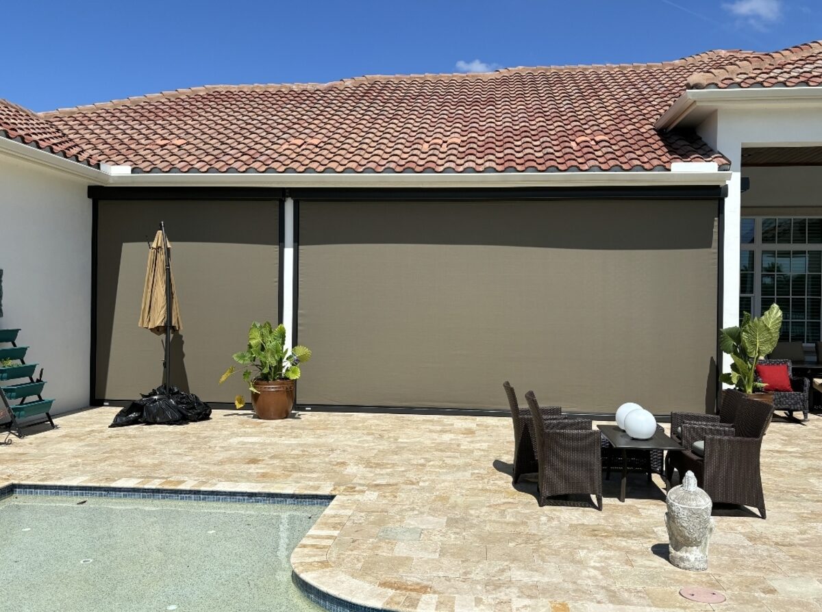 Hurricane-rated motorized screens protecting a Sarasota County pool lanai