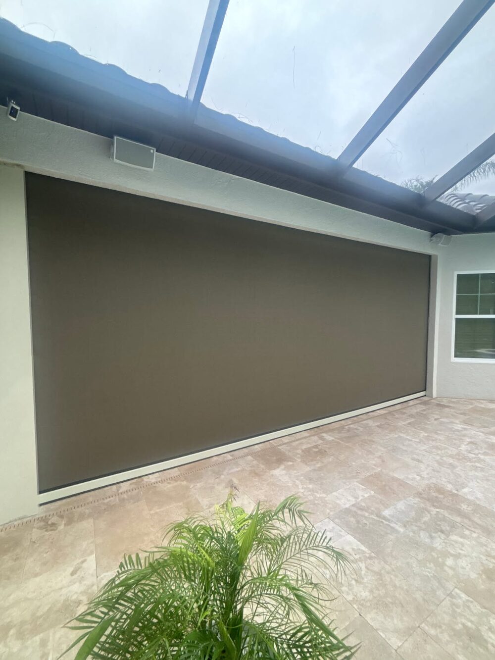 MagnaTrack retractable motorized screen on a Lakewood Ranch lanai